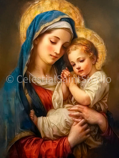 Mary holding baby Jesus. Mary, in a blue headscarf and red dress, gazes down affectionately at Jesus, who appears to be in prayer or blessing, clad in white. The soft glow and warm tones give the artwork a serene, holy ambiance.