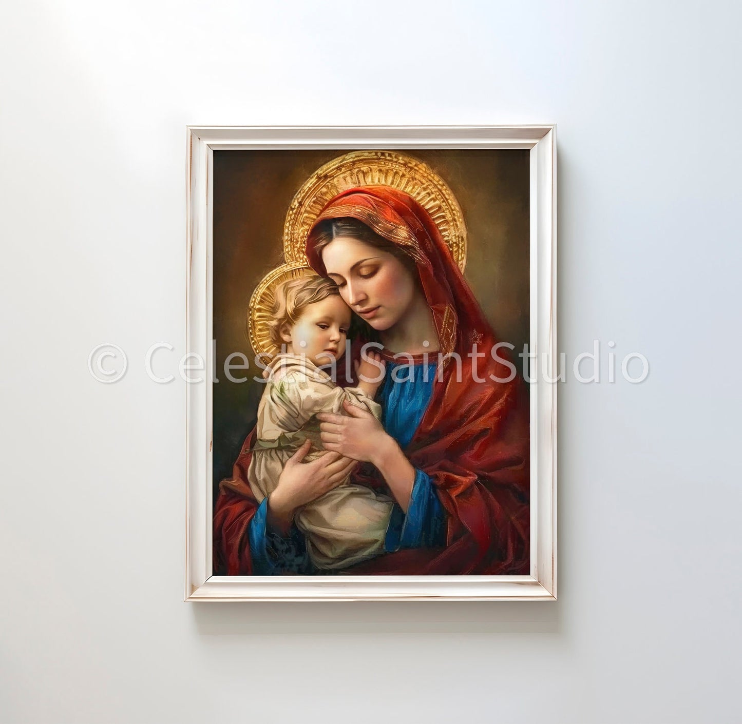 Mary in a red headscarf and blue dress, cradling the child Jesus wearing a beige tunic, both adorned with ornate golden halos. They are depicted with serene expressions in an intimate embrace, set against a soft, glowing background